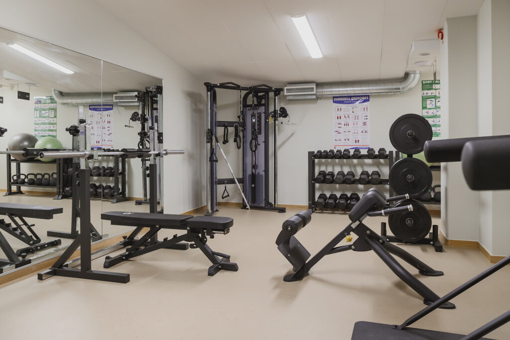 The hotel's gym with machines and weights